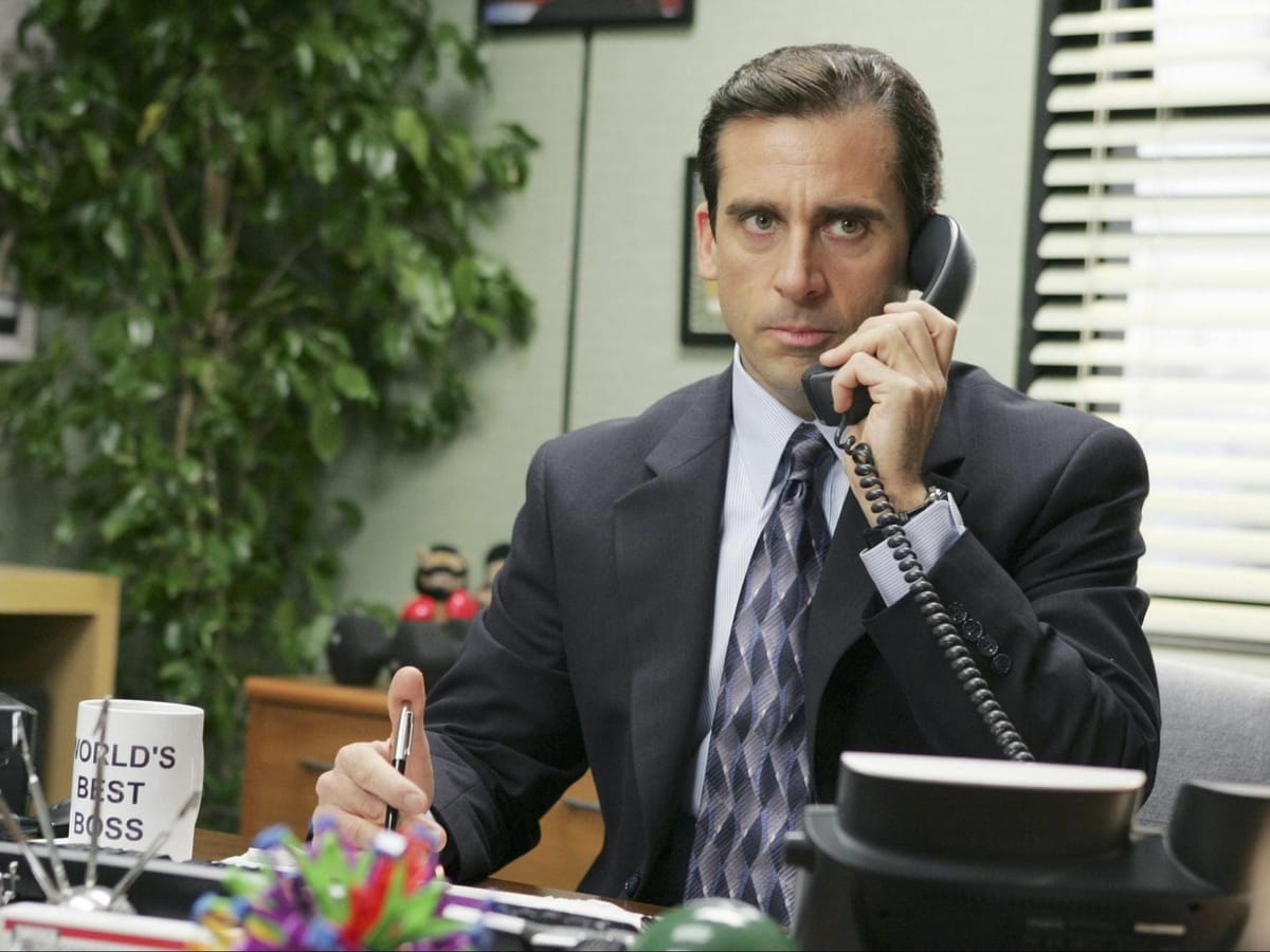 What company buys Dunder-Mifflin in "The Office"?